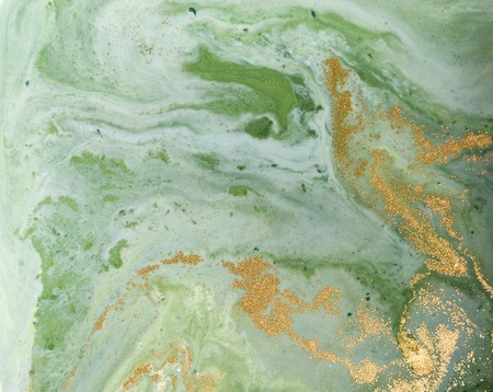 Marbled green and golden abstract background. Liquid marble pattern.の写真素材