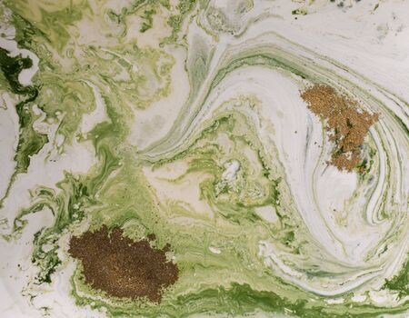 Marbled green and golden abstract background. Liquid marble pattern