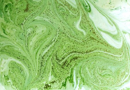 Marbled green and golden abstract background. Liquid marble pattern