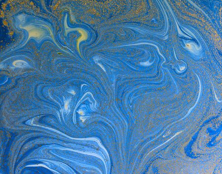 Marbled blue and golden abstract background. Liquid marble patternの写真素材