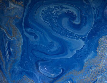 Marbled blue and golden abstract background. Liquid marble pattern