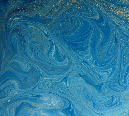 Marbled blue and golden abstract background. Liquid marble patternの写真素材