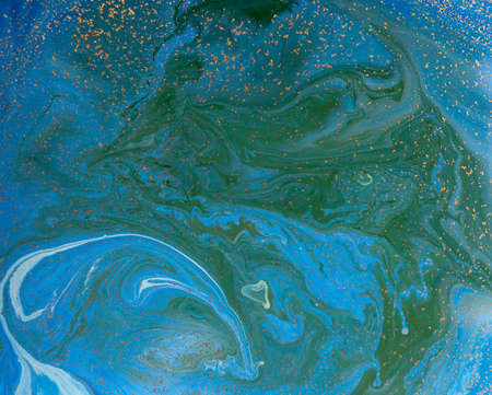 Marbled blue and golden abstract background. Liquid marble pattern.の写真素材