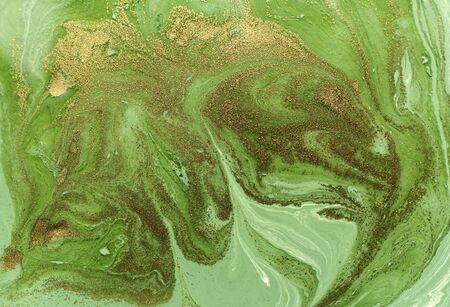 Marbled green and gold abstract background. Liquid marble pattern.の写真素材