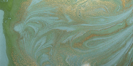 Marbled green and gold abstract background. Liquid marble patternの写真素材