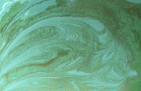 Marbled green and gold abstract background. Liquid marble patternの写真素材