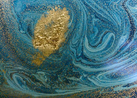 Marbled blue and golden abstract background. Liquid marble patternの写真素材