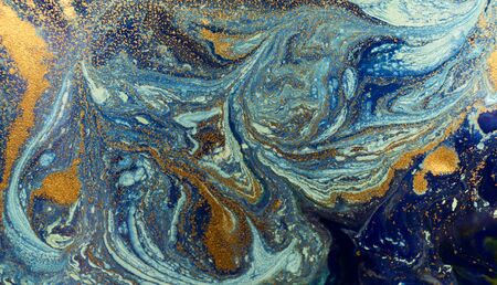 Marbled blue and golden abstract background. Liquid marble patternの写真素材