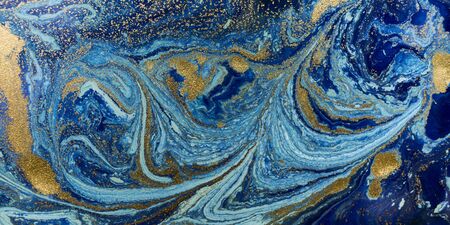 Marbled blue and golden abstract background. Liquid marble patternの写真素材