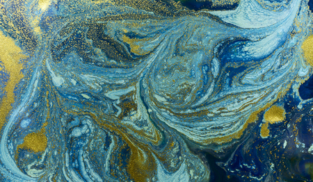 Marbled blue and golden abstract background. Liquid marble patternの写真素材