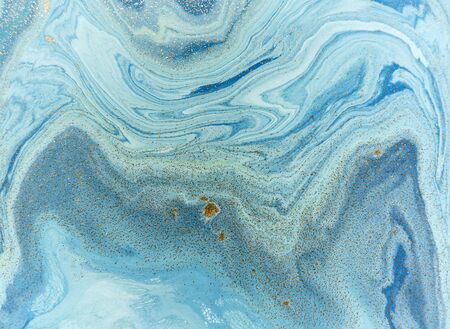 Marbled blue and golden abstract background. Liquid marble patternの写真素材