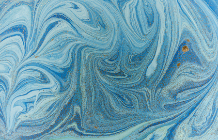 Marbled blue and golden abstract background. Liquid marble patternの写真素材
