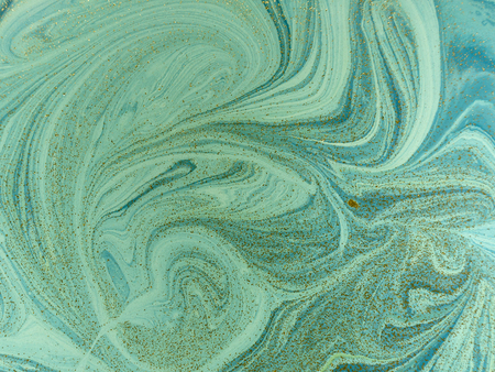 Marbled blue, green and golden abstract background. Liquid marble patternの写真素材