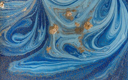 Marbled blue and golden abstract background. Liquid marble patternの写真素材