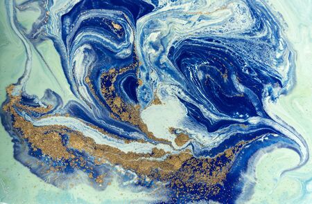 Marbled blue and golden abstract background. Liquid marble patternの写真素材