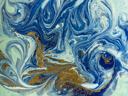 Marbled blue and golden abstract background. Liquid marble patternの写真素材