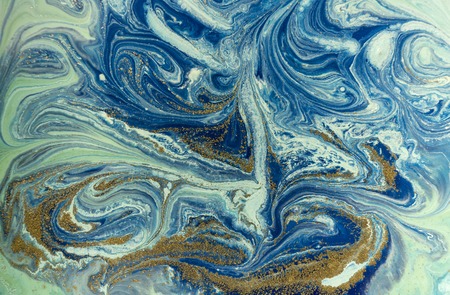 Marbled blue and golden abstract background. Liquid marble patternの写真素材