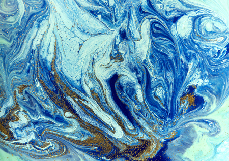 Marbled blue and golden abstract background. Liquid marble patternの写真素材