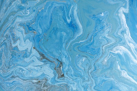 Marbled blue and golden abstract background. Liquid marble patternの写真素材