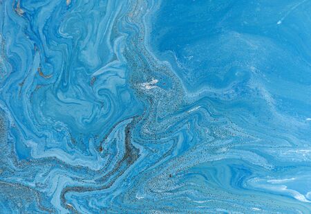 Marbled blue and golden abstract background. Liquid marble patternの写真素材