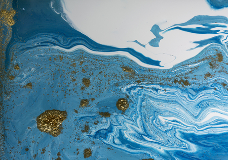 Marbled blue and golden abstract background. Liquid marble pattern.の写真素材