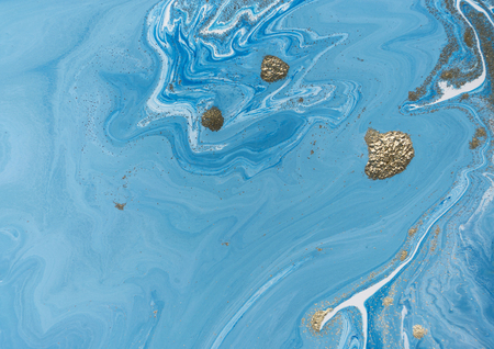 Marbled blue and golden abstract background. Liquid marble pattern.の写真素材
