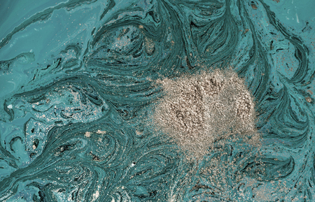 Marbled blue abstract background with golden sequins. Liquid marble ink patternの写真素材