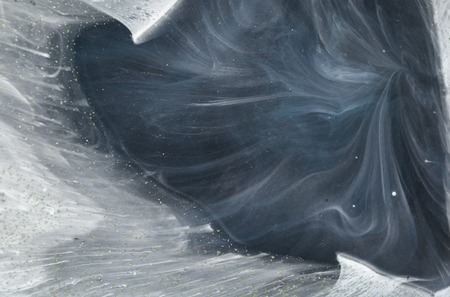 Marbled abstract background with golden sequins. Liquid marble ink pattern.の写真素材