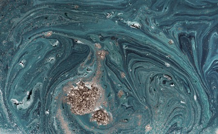 Marbled blue abstract background with golden sequins. Liquid marble ink pattern