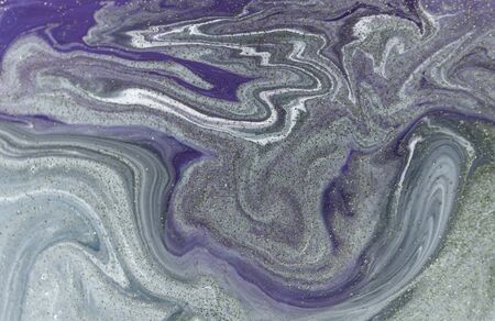 Marbled purple abstract background with golden sequins. Liquid marble ink pattern.の写真素材