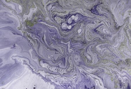 Marbled purple abstract background with golden sequins. Liquid marble ink pattern.の写真素材