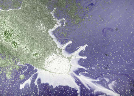 Marbled purple abstract background with golden sequins. Liquid marble ink pattern.の写真素材