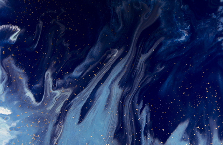 Marbled blue abstract background with golden sequins. Liquid marble ink pattern.の写真素材