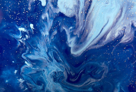 Marbled blue abstract background with golden sequins. Liquid marble ink pattern.の写真素材