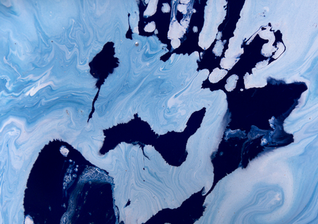 Marbled blue abstract background with golden sequins. Liquid marble ink pattern.の写真素材