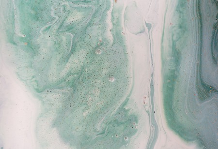 Marble abstract acrylic background. Nature green marbling artwork texture. Golden glitter.の写真素材