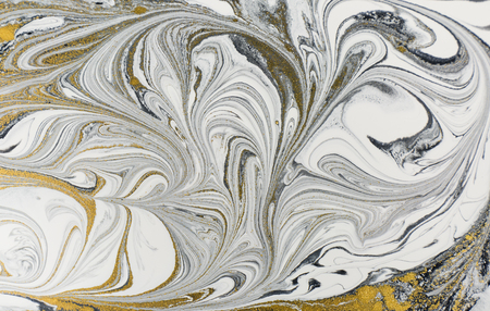 Marble abstract acrylic background. Nature black marbling artwork texture. Golden glitter.の写真素材