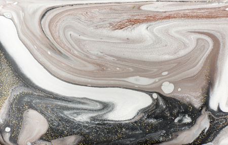 Marble abstract acrylic background. Nature black marbling artwork texture. Golden glitter.の写真素材