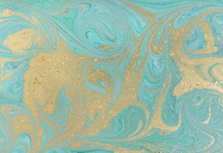 Marble abstract acrylic background. Nature blue marbling artwork texture. Golden glitter.の写真素材