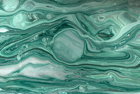 Gold marbling texture design. Green and golden marble pattern. Fluid art.の写真素材