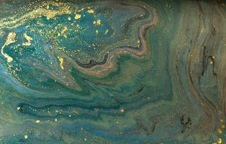 Green marble abstract acrylic background. Marbling artwork texture. Agate ripple pattern. Gold powder.の写真素材