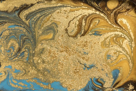 Gold marbling texture design. Blue and golden marble pattern. Fluid art.