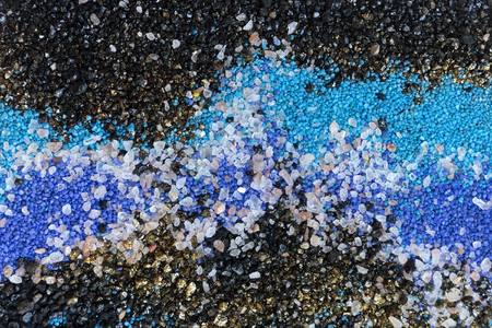 Layered colorful sand pattern. Marble style background. Blue and gold powder texture.の写真素材