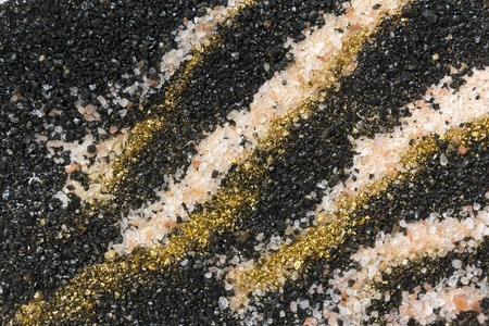 Layered colorful sand pattern. Marble style background. Black, white and gold powder textureの写真素材