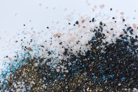 Layered colorful sand pattern. Marble style background. Blue and gold powder texture.の写真素材