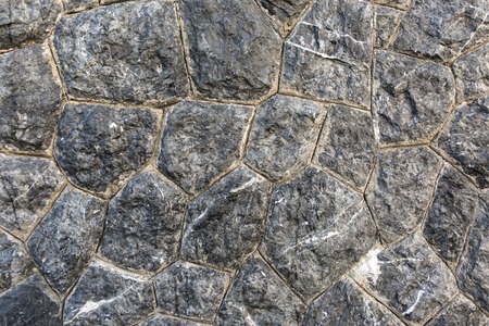 Old rough stone wall. Rock gray background.の写真素材