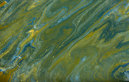 Blue and gold marbling pattern. Golden marble liquid texture.の写真素材