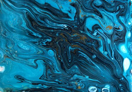 Blue and gold marbling pattern. Golden marble liquid texture