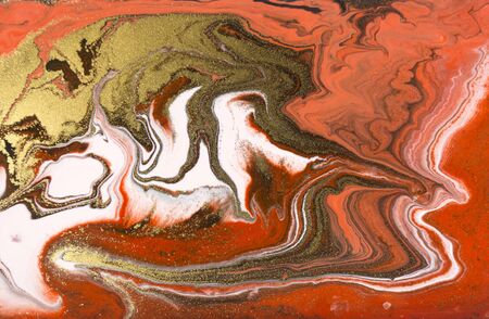 Red and gold marbling pattern. Golden marble liquid textureの写真素材