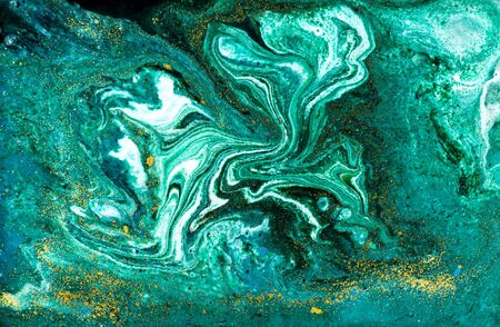 Liquid uneven green marbling pattern with glare of lightの写真素材